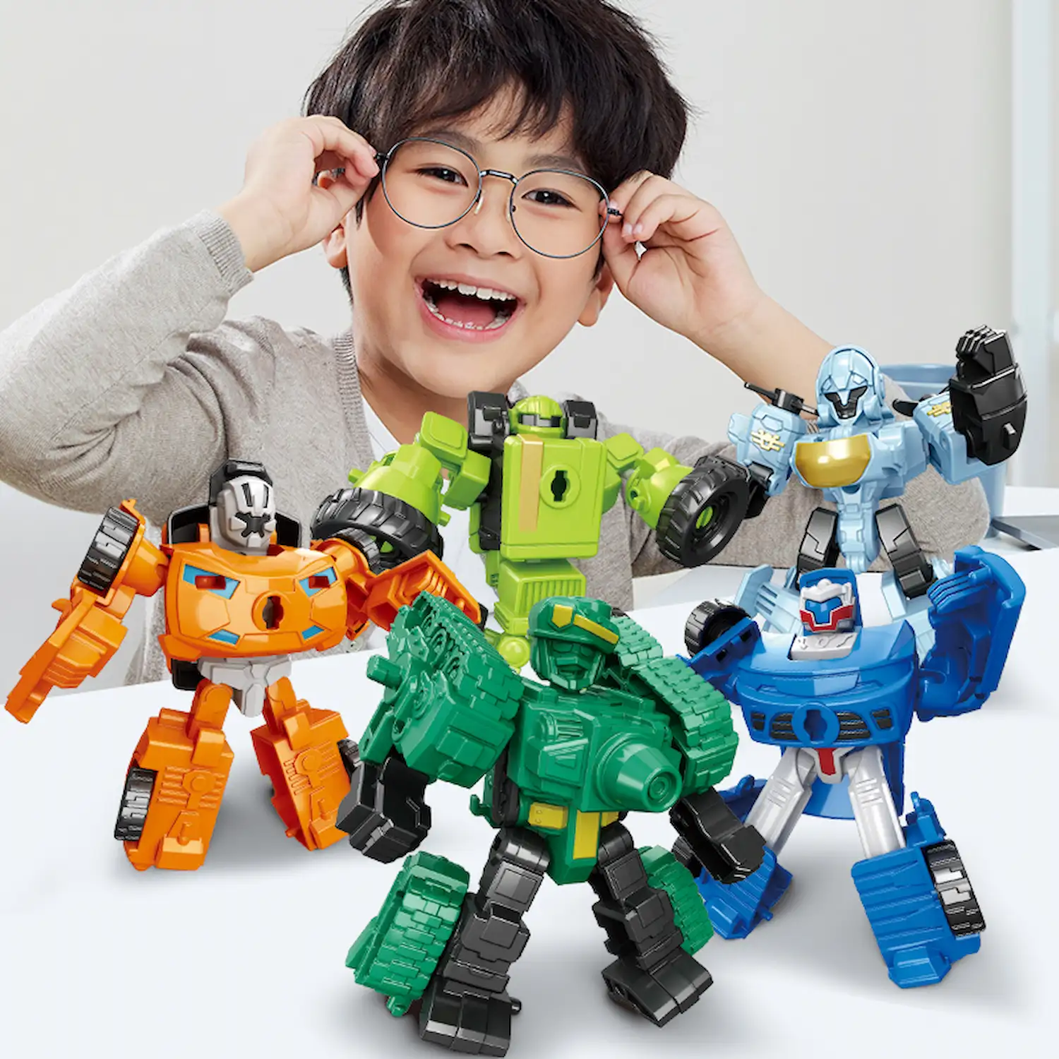 kid is playing Transformer Combiners Toys, Tank, Sedan, SUV, Tractor, Fighter Jet With Propeller, Car, Vehicle kid is playing Transformer Combiners Toys, Tank, Sedan, SUV, Tractor, Fighter Jet With Propeller, Car, Vehicle