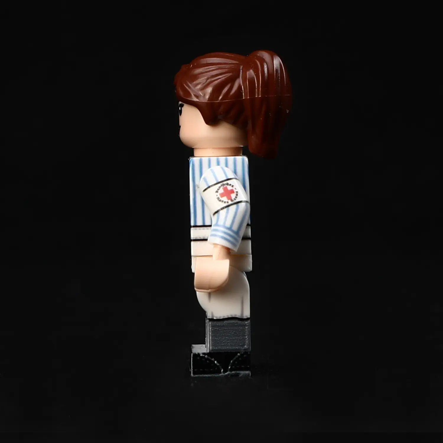 the left side of Minifigure - German medical Charlotte female nurse from the World War II era (LEGO Compatible) the left side of Minifigure - German medical Charlotte female nurse from the World War II era (LEGO Compatible)