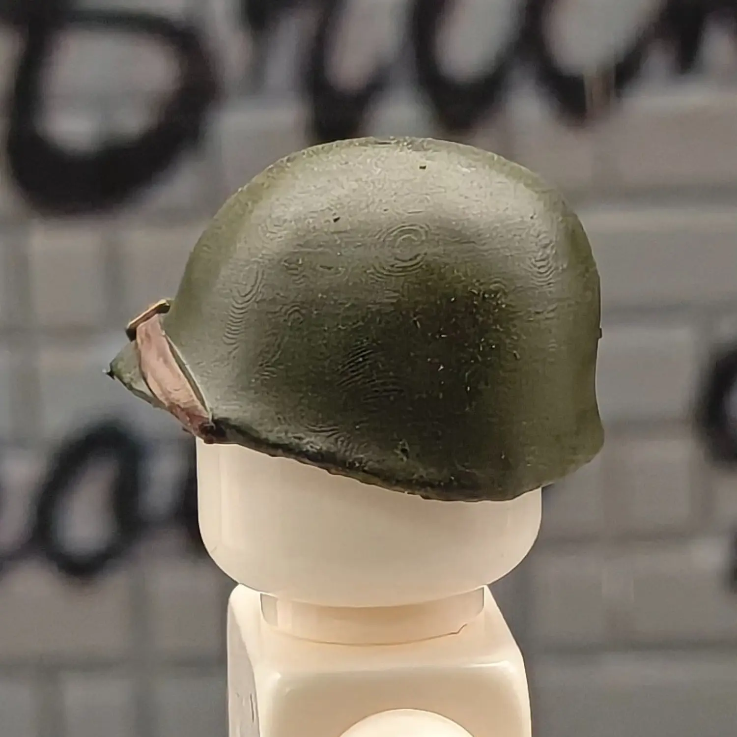 the left side of the Custom Piece Miniature – U.S. Army M1 Helmet dark Olive Drab Green – 3D Print for LEGO minifigure the left side of the Custom Piece Miniature – U.S. Army M1 Helmet dark Olive Drab Green – 3D Print for LEGO minifigure